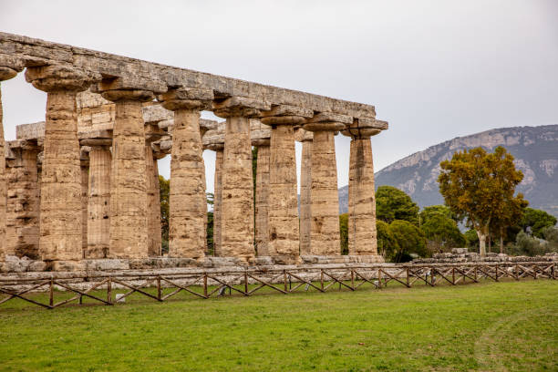 Temple Of Athena, Paestum, Italy Greek Temple And Mountain At Paestum,Campania,Italy temple of neptune doric campania italy stock pictures, royalty-free photos & images