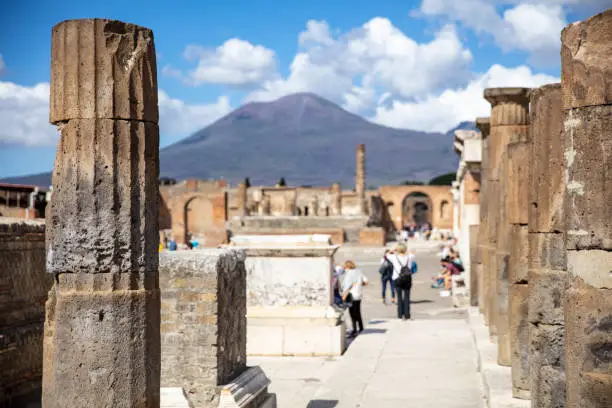 Ruins In City Of Pompeii And Vulcano Mount Vesuvius In Background At Campania,Italy