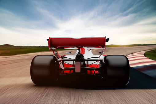 front view of fast moving generic red race car on a race track, motion blur,  3D, car of my own design.