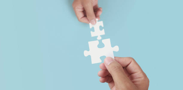 istock Holds in hand  jigsaw puzzle. Business solutions success 1326102145