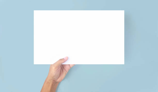 istock Hands holding paper blank for  letter paper 1326102147