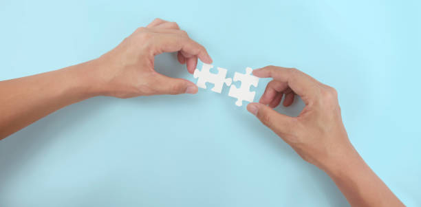 istock Holds in hand  jigsaw puzzle. Business solutions success 1326102154