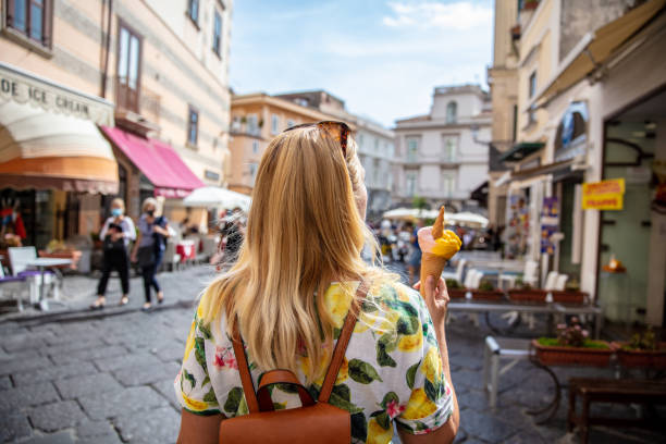 Woman With Ice Cream At Positano,Italy Young Woman Holding Ice Cream At Positano Town,Amalfi,Italy sorrento italy photos stock pictures, royalty-free photos & images