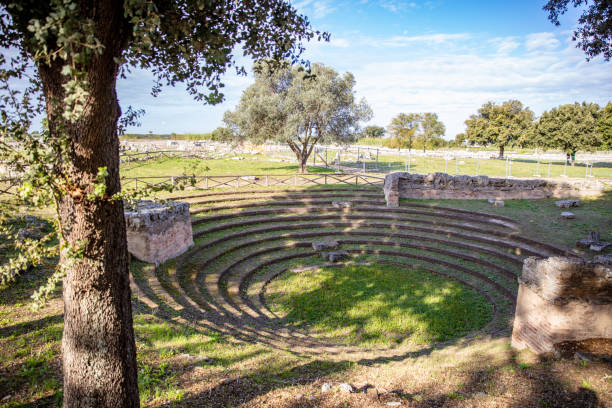 Ancient Greek Amphitheatre At Italy Greek Amphitheater In Archaeological Park,Paestum,Campania,Italy temple of neptune doric campania italy stock pictures, royalty-free photos & images