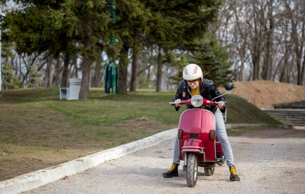 istock Urban girl on vespa 1326103015