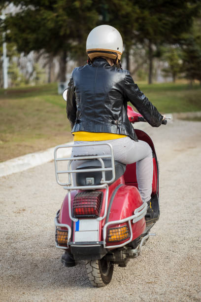 istock Urban girl on vespa 1326103077