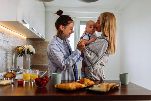 istock Affectionate women enjoying in time with a baby son at home 1326105263