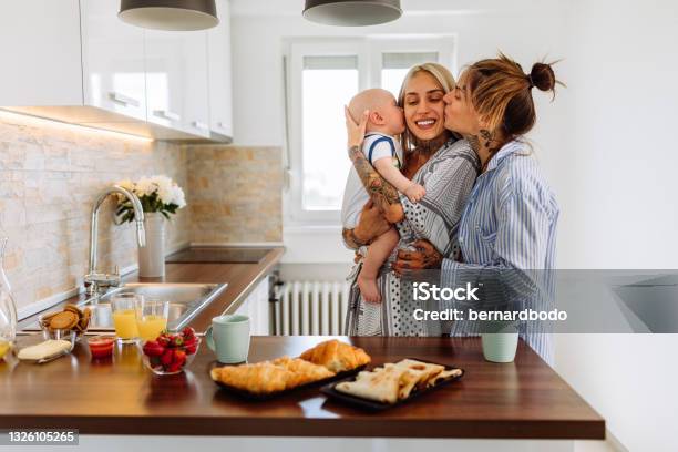 Cheerful Young Lesbians With Baby Boy Stock Photo - Download Image Now - LGBTQIA People, Lesbian, Gay Couple