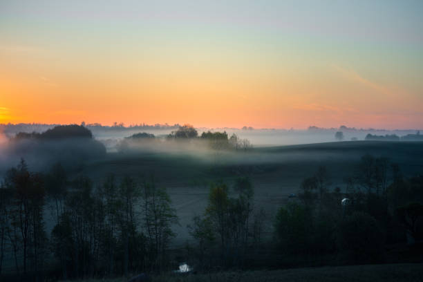 istock A misty sunrise landscape over the small river valley. 1326105292