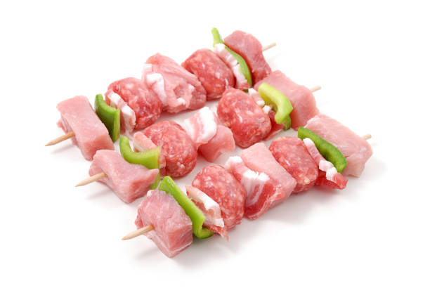 Meat skewers isolated on white background