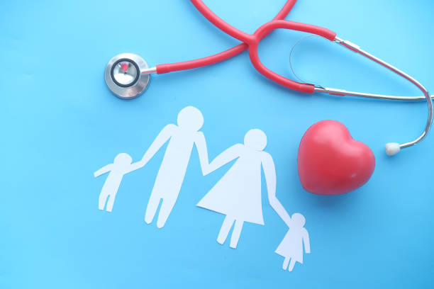 istock Family and heart with stethoscope top down 1326108293