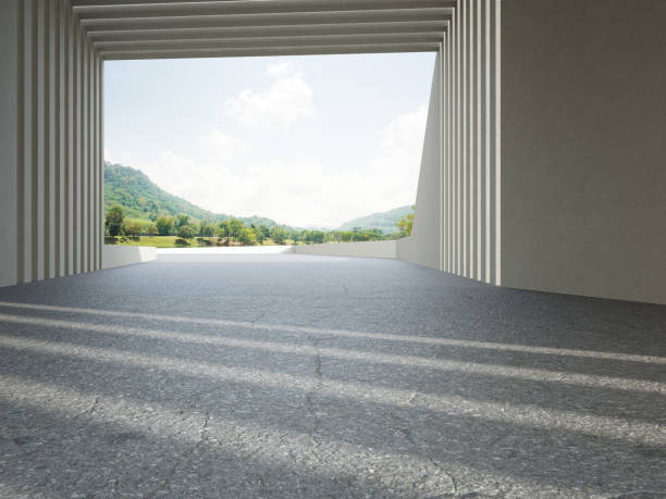 istock Abstract architecture design of modern building. Empty parking area floor and concrete wall with mountain and blue sky lake view. 1326109544