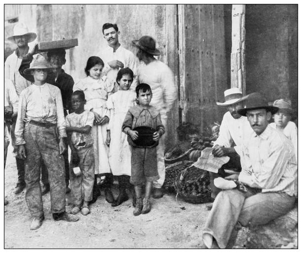 Antique black and white photograph of people from islands in the Caribbean and in the Pacific Ocean; Cuba, Hawaii, Philippines and others: Market in Cuba