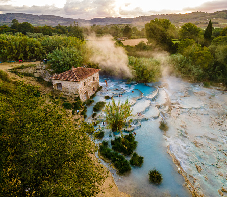 People Enjoying At Thermal Waterfalls And Travertine Pool