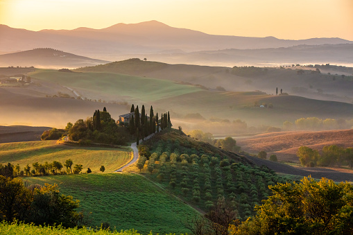 Landscape of a misty morning and foggy sunrise in Tuscany