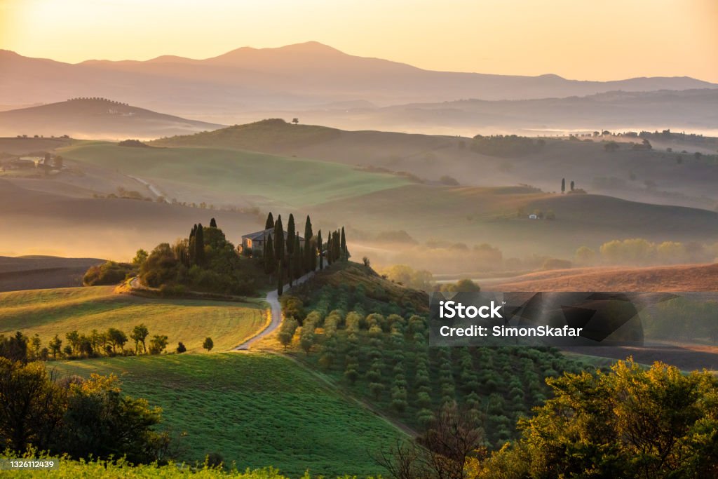 Landscape of a foggy sunrise Landscape of a misty morning and foggy sunrise in Tuscany Tuscany Stock Photo