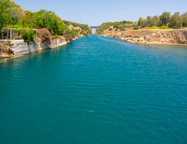 panoramic view from the immersion bridge in isthmia to the entrance to the corinth canal from the saronic gulf in the peloponnese in greece - gulf of corinth imagens e fotografias de stock