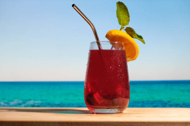 istock Rum cocktail with cranberry juice on the tropical beach 1326115318