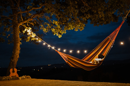 Landscape of a person resting on a hammock enjoying the amazing view