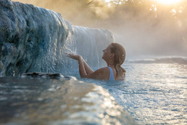 istock Young woman playing in natural spa 1326117467