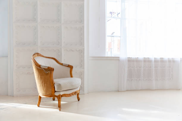 istock Stylish loft bedroom interior. Spacious design apartment with light walls large windows and armchair. Clean modern decoration with elegant furniture in minimalist Scandinavian style 1326118580
