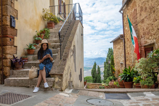 Portrait of a cute girl sitting on an old staircase
