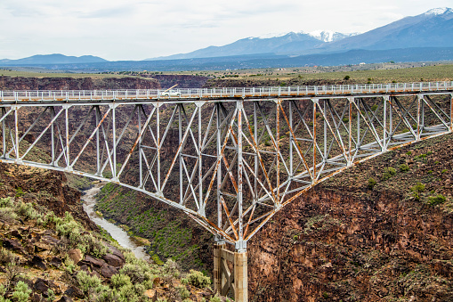 The Rio Grande Gorge Bridge-a steel deck arch bridge across the Rio Grande Gorge 10 miles) northwest of Taos NM United States.- the tenth highest bridge in the USA.