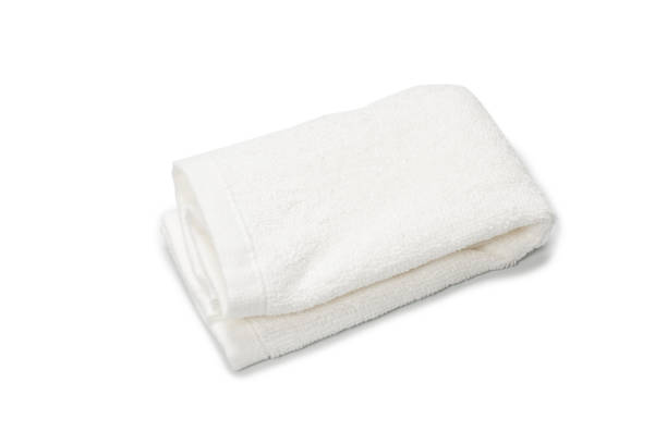istock White fluffy cotton towel isolated on a white background. 1326119892