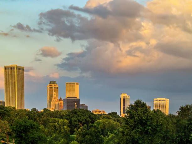istock Tulsa skyline from the Northwest over trees and under and beautiful sunset sky 1326120006