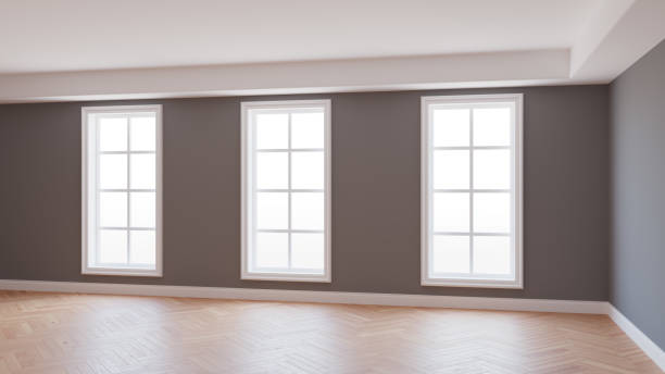 istock Beautiful Empty Interior with Grey Walls, Three Large Windows, Light Parquet Floor and a white Plinth with Work Path on Windows. 3D rendering. Ultra HD 8K 7680x4320 1326120286