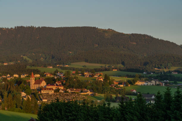 istock Semriach village with Schockl hill over in sunset sunny evening 1326124874