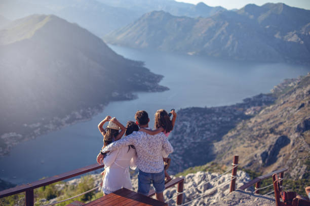 Family with two little daughters travel in nature, making selfie, smiling Family with two little daughters travel in nature, making selfie, smiling kotor montenegro stock pictures, royalty-free photos & images
