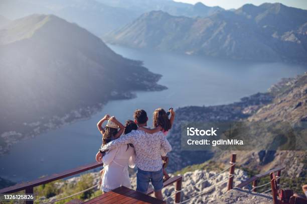 Family With Two Little Daughters Travel In Nature Making Selfie Smiling Stock Photo - Download Image Now