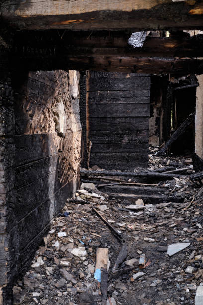 istock Dark burnt wooden house corridor after fire 1326127643