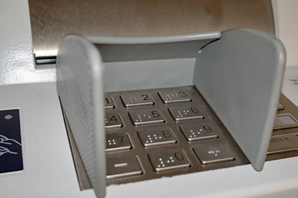 istock ATM keyboard with old and scratched metal surface. Metal panel of ATM with keyboard for code pin entry. Selective focus, side view. 1326127684
