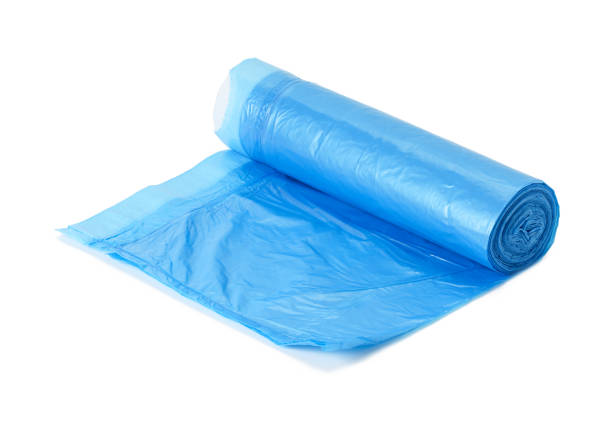 istock blue plastic trash bags with strings isolated on white background, close up 1326129276