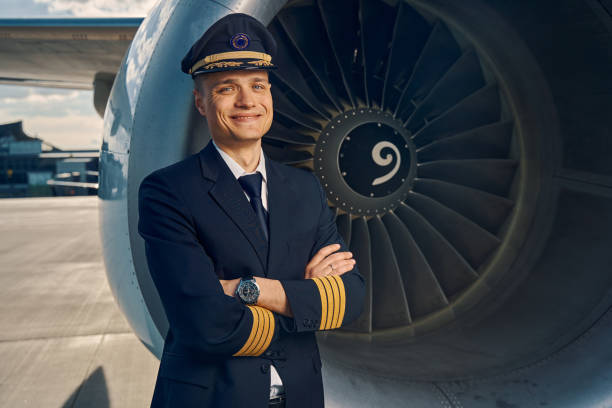istock Cheerful aviator posing for the camera after the flight 1326132136