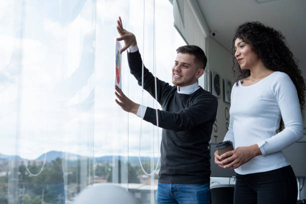 istock two coworkers a man and a woman are in the office discussing work issues 1326132161