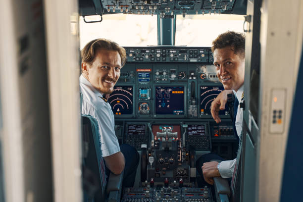istock Joyous pilot and a co-pilot looking out of the cockpit 1326132230