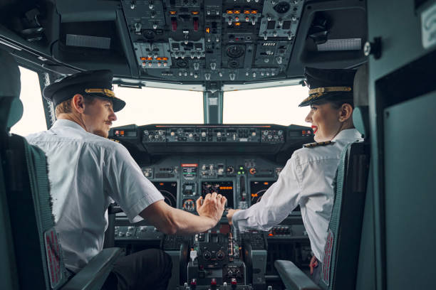 istock Two professional aviators sitting in the cockpit during the take-off 1326132427