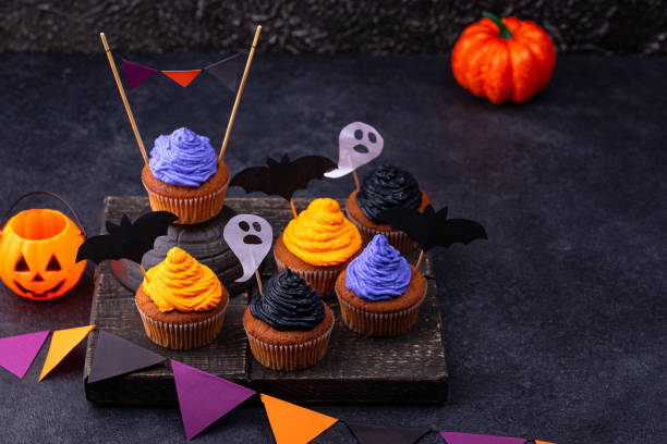 istock Halloween cupcakes with color cream 1326133775