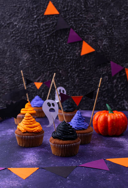 istock Halloween cupcakes with color cream 1326133782