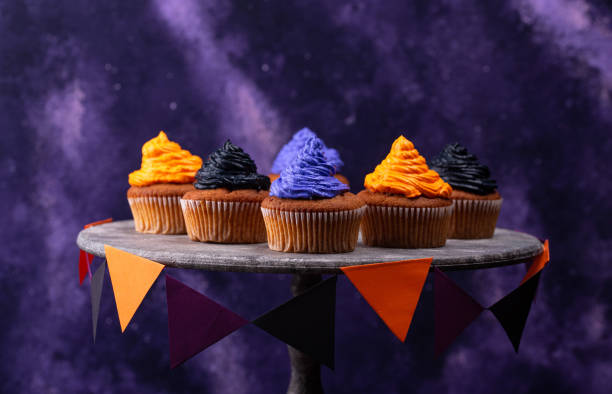 istock Halloween cupcakes with color cream 1326133789
