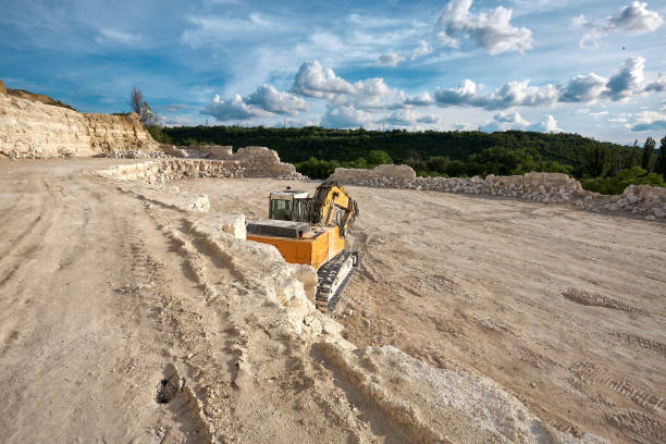 istock Excavator stands on the background of a stone quarry. 1326134816