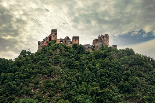 Germany, Rhine River - July 16, 2017:  Castle sitting up high on the mountainside on the Rhine River