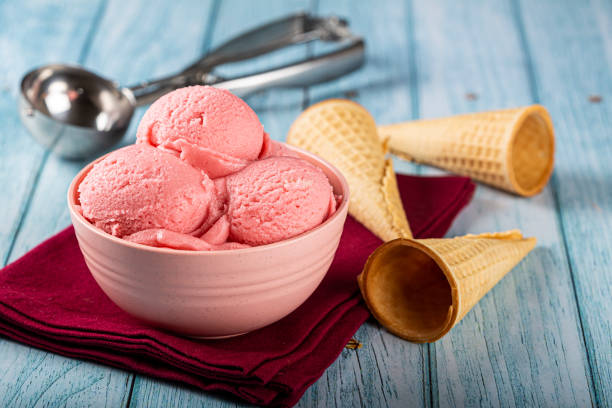 istock Bowl with strawberry ice cream balls. 1326144011