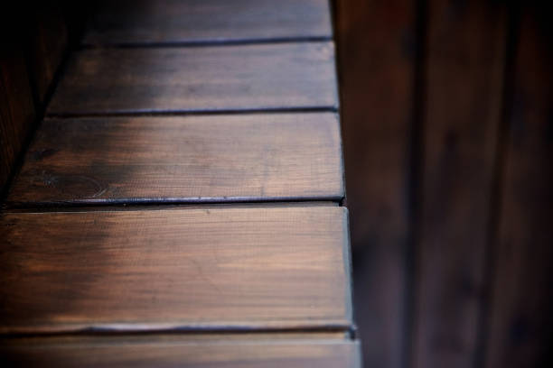 istock Wall corner sheathed with wooden board 1326144019