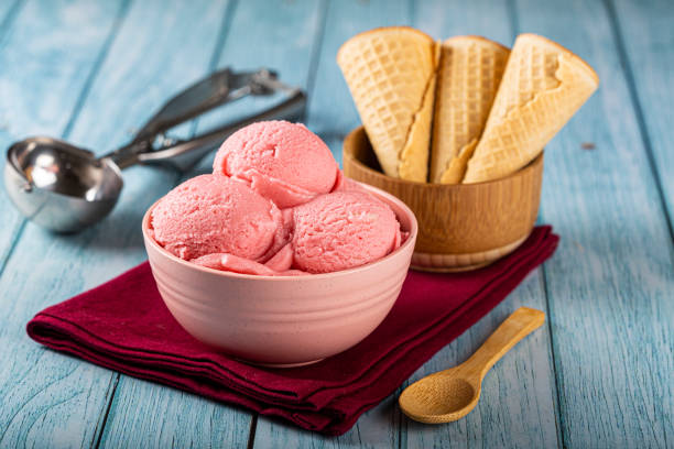 istock Bowl with strawberry ice cream balls. 1326144033