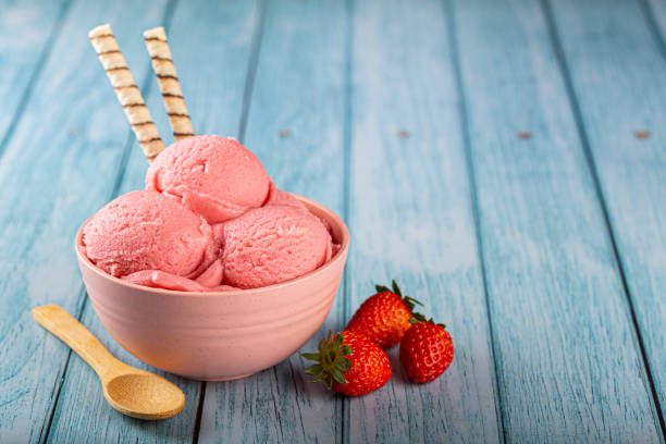 istock Bowl with strawberry ice cream balls. 1326144072