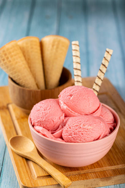 istock Bowl with strawberry ice cream balls. 1326144082